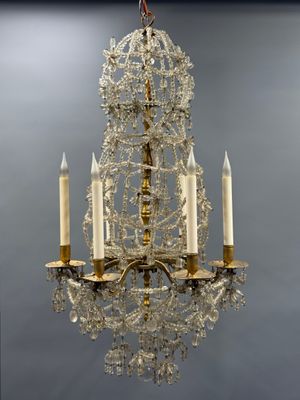 an image of a chandelier with three candles hanging from it