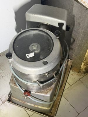 an image of a toilet with a metal tank on it
