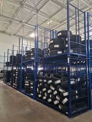 many tires stacked on the shelves in the warehouse