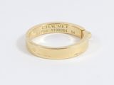 a close up of a gold ring with a name engraved on it