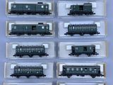 a lot of different model trains on display in a box