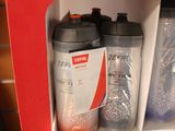 a red vending machine with two bottles of water in it