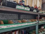 many boxes of tools on the shelves in the room