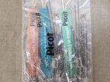 a bag of toothbrushes and toothpaste on a table