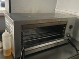 a toaster oven sitting on a counter in a kitchen