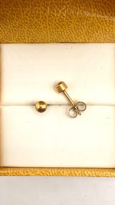 a pair of scissors in a box on a table