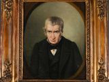 portrait of a man in a black coat and bow tie