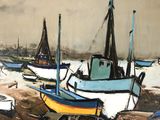 many boats that are sitting in the sand