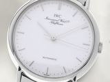 a close up of a wrist watch with a white dial
