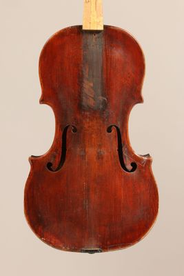 an old violin with a wooden back and a wooden bow