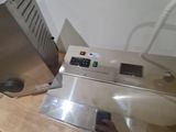 a machine that is sitting on top of a wooden table