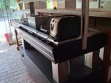 a microwave and toaster sitting on a table in a kitchen
