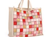 a close up of a bag with a patchwork design on it