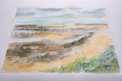 a watercolor painting of a beach scene on a white surface