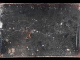 a picture of a piece of glass with a cross on it