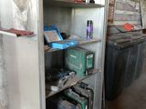 a metal cabinet that has many different items on it