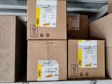 several boxes are stacked on top of each other on a shelf