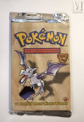 a close up of a box of pokemon trading cards on a table