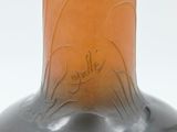 an image of a glass bottle with a design on it
