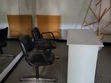 a room with chairs and a table in it
