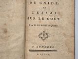an old book opened to show the title of a poem