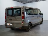 a silver van that is parked in a room