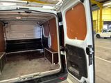 a white van that is parked inside of a building