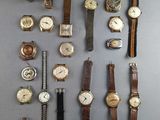 a lot of watches that are sitting on a table