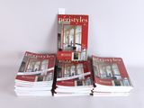 several books are stacked on top of each other on a table