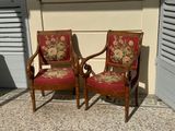 two chairs that are sitting next to each other