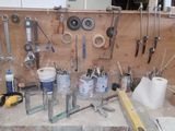 a workbench with many tools on it in the room