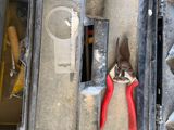 two pliers and a pair of pliers in a tool box