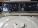 a picture of a white jeep parked in a garage