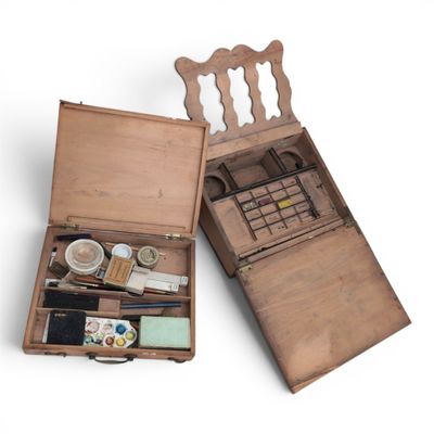 an old wooden box with a bunch of items inside of it
