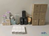 many boxes of skin care products sitting on a table
