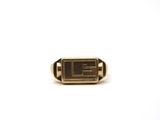 a close up of a gold ring with a number on it