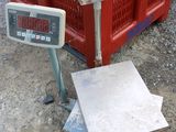 an image of a scale with a box of fruit in the background