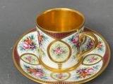 a cup and saucer on a saucer on a table