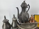 a lot of silver objects on a table