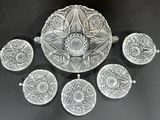 six pieces of glass are arranged in a circle on a black surface