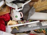 a pile of assorted items that include a teapot, a teapot, a brush, and other items