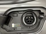 a close up of a car ' s charging station with a car plugged into it