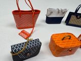 many different purses that are on a white surface