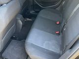 the back seats of a car are empty in a parking lot