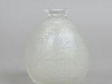 an image of a white glass vase on a table