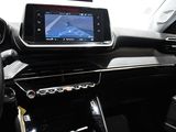 the dashboard of a car with a gps device in the center