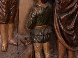 a statue of a man and a woman with a dog