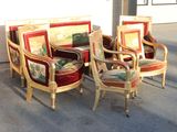 four chairs and a couch in the middle of the street