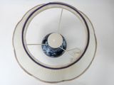 a white plate with a blue and white bowl inside of it