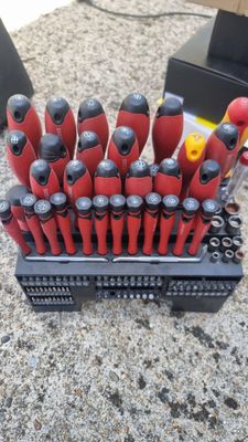 a bunch of tools that are sitting in a holder
